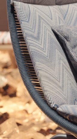 An up-close photo of a lounge chair to highlight the fabric's angle pattern brought to life by Missoni.